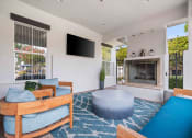 Thumbnail 13 of 28 - Relax poolside with TV and fireplace for ultimate comfort and entertainment