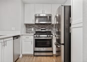 Thumbnail 2 of 28 - Stainless steel appliances in the upgraded kitchens at Ascent at the Galleria in Roseville, California