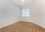 Thumbnail 32 of 46 - an empty room with carpet and a window at Metro Gateway, Riverside, 92503