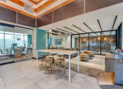 Thumbnail 8 of 46 - the lobby of a building with tables and chairs at Metro Gateway, Riverside, CA