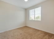 Thumbnail 31 of 46 - an empty room with carpet and a window at Metro Gateway, California