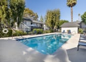 Thumbnail 3 of 22 - our apartments have a swimming pool with chairs and trees