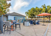Thumbnail 7 of 30 - Our huge pool deck is complimented with patio tables, chairs, and umbrellas. Conveniently located right next to our state-of-the-art gym