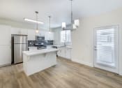 Thumbnail 25 of 45 - Each unit features a fully updated kitchen with sleek, contemporary amenities, including stainless steel appliances, new cabinetry, and elegant countertops.