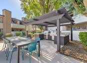 Thumbnail 5 of 29 - Chatsworth Pointe bbq are with a table and chairs