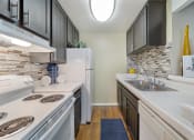 Thumbnail 13 of 29 - Modern elegance meets culinary charm at Chatsworth Pointe. Feast your eyes on the sleek sophistication of our newly updated kitchen