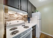 Thumbnail 12 of 29 - Modern elegance meets culinary charm at Chatsworth Pointe. Feast your eyes on the sleek sophistication of our newly updated kitchen