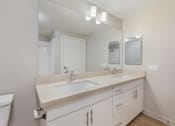 Thumbnail 21 of 46 - a bathroom with two sinks and a large mirror at Metro Gateway, California