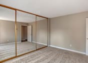 Thumbnail 12 of 19 - a bedroom with a large mirror at Scripps Poway Villas, Poway, CA