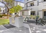 Thumbnail 7 of 45 - Grill, chill, and unwind in style at the Michael B apartment complex's inviting outdoor patio, where good times and great food come together seamlessly.at The Michael B Townhomes and Flats, Las Vegas,