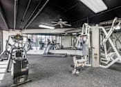 Thumbnail 9 of 28 - Feel the freedom of fitness under the comforting sway of the ceiling fan at Independence Plaza's state-of-the-art gym.
