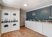 Thumbnail 6 of 19 - a laundry room with washers and dryers at Scripps Poway Villas, Poway, CA