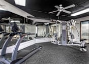 Thumbnail 7 of 28 - Sweat it out under the cool breeze: Our gym at Independence Plaza keeps you motivated with weights and a refreshing ceiling fan. Your fitness journey starts here!