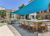 Thumbnail 9 of 42 - Poolside BBQ area  at Trevi Apartment Homes, Chandler, 85224