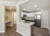 Thumbnail 21 of 42 - A modern kitchen featuring stainless steel appliances at Trevi Apartment Homes, Chandler