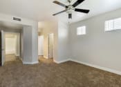 Thumbnail 38 of 42 - Relax in our carpeted bedroom, complete with a soothing ceiling fan at Trevi Apartment Homes, Chandler, 85224