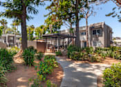 Thumbnail 17 of 19 - a courtyard with trees and plants at Scripps Poway Villas, California