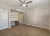 Thumbnail 36 of 42 - Enjoy a serene space with a desk for work and a ceiling fan for comfort at Trevi Apartment Homes, Arizona