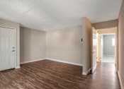 Thumbnail 10 of 19 - a bedroom with hardwood flooring and white door at Scripps Poway Villas, Poway, CA 92064 
