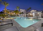 Thumbnail 4 of 45 - As the sun sets and twilight takes over, the pool transforms into a serene oasis, with ambient lighting enhancing the luxurious feel of the surroundings.