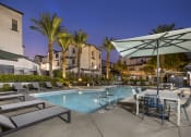 Thumbnail 2 of 45 - Our refreshing pool is surrounded by brand-new, stylish lounge chairs, perfect for soaking up the sun or unwinding with a good book.