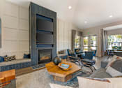 Thumbnail 33 of 50 - The clubhouse features dual TVs and a cozy fireplace, creating a warm and inviting space for residents to relax and socialize at Ascent at the Galleria.