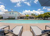 Thumbnail 2 of 50 - Relax on our stylish pool deck, just steps from the clubhouse and leasing office—complete with lounge chairs and sunny vibes for the perfect Roseville retreat.