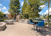 Thumbnail 5 of 50 - Our tree-lined pool deck features a large pool, jacuzzi, two propane grills, plenty of seating, and scenic views—steps from the clubhouse and leasing office at Ascent at the Galleria.