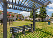 Thumbnail 42 of 50 - Our gated dog park features a semi-shaded gazebo and comfortable seating, creating a relaxing space for pet owners while their dogs play and socialize at Ascent at the Galleria.