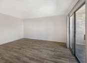 Thumbnail 15 of 21 - Sedona Apartments in Moreno Valley offers renovated units with updated flooring and inviting living rooms, combining modern comfort with a welcoming feel.