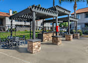 Thumbnail 7 of 21 - Sedona Apartments in Moreno Valley feature a renovated pool deck and resident gas grills, perfect for relaxing and outdoor cooking.