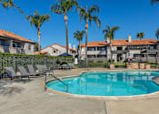Thumbnail 5 of 21 - Sedona Apartments in Moreno Valley features a renovated pool deck with stylish lounge chairs—perfect for relaxing and soaking up the sun.