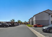Thumbnail 21 of 21 - Sedona Apartments in Moreno Valley feature comfortable units, each with a dedicated parking spot and freshly paved parking for easy access.
