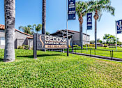 Thumbnail 2 of 21 - Sedona Apartments in Moreno Valley welcomes you with a modern, inviting entrance framed by lush landscaping and stylish, well-lit pathways.