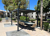 Thumbnail 9 of 32 - An ideal lounge setting for poolside enjoyment at Boulders at Lookout Mountain Apartment Homes, Arizona, 85022