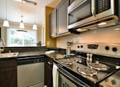 Thumbnail 19 of 28 - Gourmet kitchens with dishwasher and disposal at Crooked Oak at Loma Verde Preserve, Novato, 94949