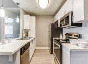 Thumbnail 19 of 19 - Modern kitchen at The Summit at Chino Hills Apartment Homes in Chino Hills, CA 91709