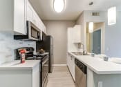 Thumbnail 14 of 19 - Modern kitchen at The Summit at Chino Hills Apartment Homes in Chino Hills, CA 91709