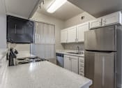 Thumbnail 21 of 29 - Our units at The Hills at Quail Run feature spacious, freshly renovated kitchens equipped with stainless steel appliances.at The Hills at Quail Run, CA, 92507