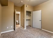 Thumbnail 26 of 29 - The master bedroom features a fully renovated en-suite bathroom and plush carpeting, creating a fresh and comfortable retreat.at The Hills at Quail Run, CA, 92507