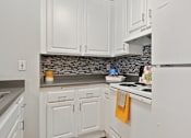 Thumbnail 14 of 15 - Spacious kitchen with pantry cabinet at Twenty 2 Eleven Apartment Homes, CA, 91306