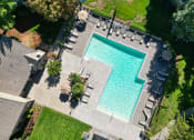 Thumbnail 23 of 28 - an aerial view of a swimming pool in a backyard