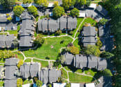 Thumbnail 24 of 28 - an aerial view of houses in a suburban neighborhood