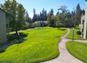 Thumbnail 26 of 28 - a grassy area with houses and trees