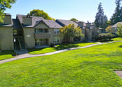Thumbnail 22 of 28 - a row of houses on a green lawn
