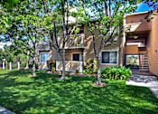 Thumbnail 13 of 26 - Tree-lined grass area in front of apartments at Club Pacifica, Benicia, CA 94510