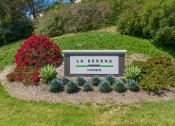Thumbnail 1 of 48 - the sign at the corner arriving to La Serena Apartments at La Serena, San Diego, California