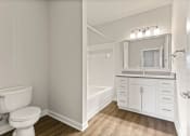 Thumbnail 26 of 41 - Bathroom with large vanity and soaking tub