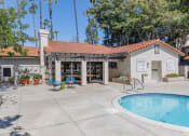 Thumbnail 27 of 48 - Clubhouse with a pool and patio at La Serena, California 92128