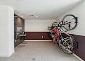 Thumbnail 31 of 33 - a group of bikes hanging on the wall in a room at Link Apartments® Broad Ave, Memphis, 38112